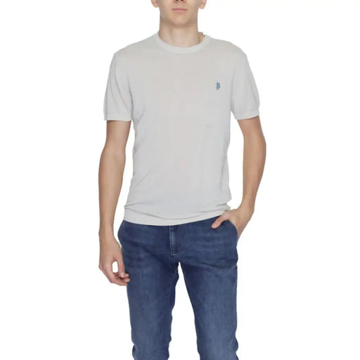 Man modeling a light gray short-sleeved shirt and blue jeans for Men’s Light Gray Shirts and Blue Jeans product