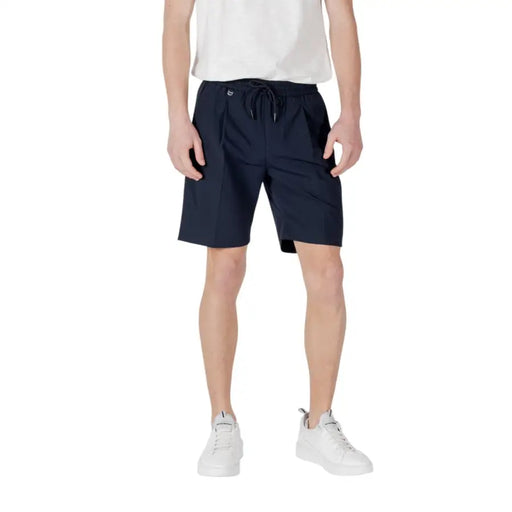 Man wearing navy blue shorts in a product display for Men’s Navy Blue Shorts