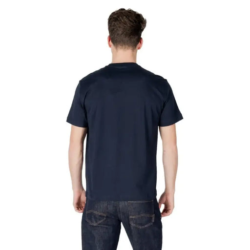 Man wearing Ea7 Men Blue Slip On Round Neck Cotton T Shirt with navy t-shirt and jeans