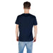 Man wearing Tommy Hilfiger navy blue T shirt and jeans
