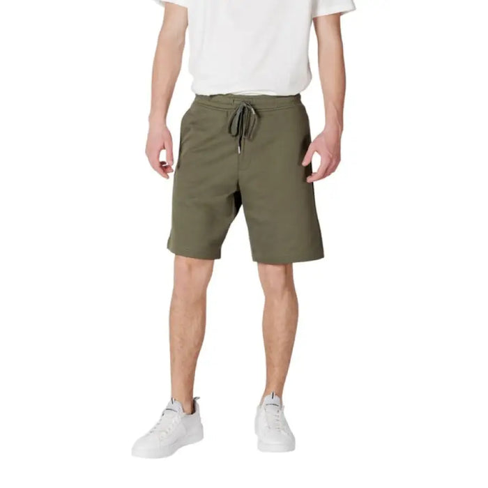 Man in olive green shorts from Replay Beige Mens Shorts with Laces and Pockets