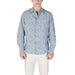Man in patterned long-sleeved shirt and light pants wearing Replay Men’s Light Blue Floral Shirt