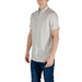 Man wearing Armani Exchange Men’s Beige Geometric Shirt with jeans and stylish pattern