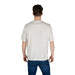 Man in patterned short-sleeved T-shirt and jeans displaying the Patterned Short Sleeve T Shirt product
