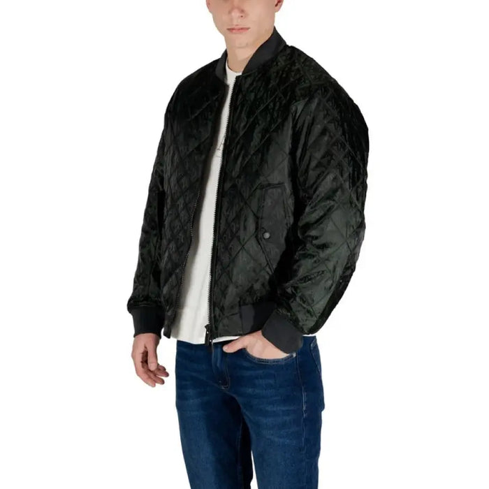 Man wearing a stylish Quilted Black Bomber Jacket, showcasing modern fashion