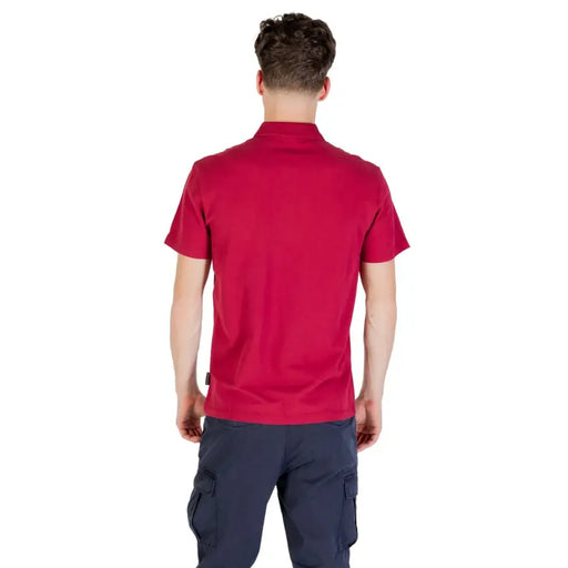 Man in a red Polo Shirt and blue cargo pants showcasing casual men’s fashion