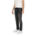 Man in slim-fit dark wash Boss Men Blue Jeans featuring a worn-out effect