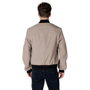 Man showcasing a stylish Beige Bomber Jacket in tan color