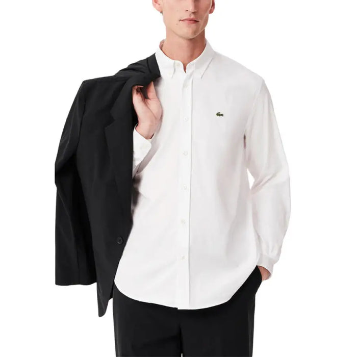 Man wearing a white button-down shirt and black blazer from Men Casual Beige Outfit with Blue Shirts and White Tote Bag