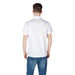 Man wearing a white polo shirt and blue jeans in product imagery