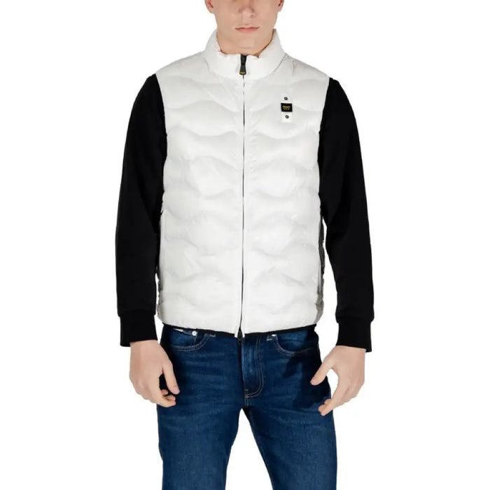 Man wearing a stylish white puffer vest for men in a trendy outfit
