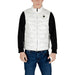 Man wearing a stylish white puffer vest for men in a trendy outfit