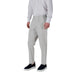 Man wearing a white shirt and gray pants in Men White Shirt and Gray Pants Apparel collection