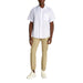 Man wearing white short-sleeved button-down shirt and khaki pants for Men White Short Sleeved Button Down Shirt and Khaki Pants product