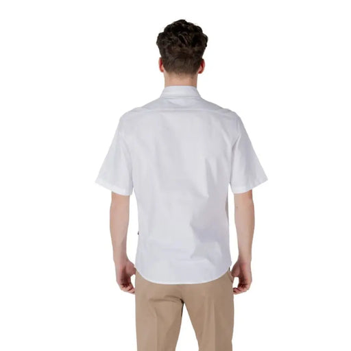 Man wearing a white short-sleeved shirt and khaki pants for Mens White Short-Sleeved Shirt and Khaki Pants product