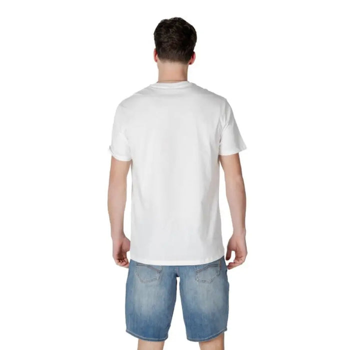 Man in white t-shirt and denim shorts wearing Armani Exchange Men White Short Round Neck Cotton T-Shirt