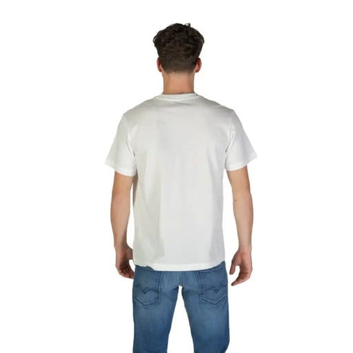 Man wearing a classic white graphic T shirt and blue jeans for Men