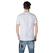 Man wearing Icon Men White Cotton Round Neck T-Shirt with blue jeans