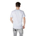 Man in white t-shirt and gray jeans showcasing Icon Men White Short Cotton Underwear