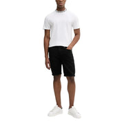Man wearing a white T-shirt and black denim shorts, suitable for casual wear