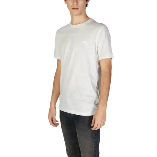 Man wearing a white T-shirt and dark jeans, showcasing the Men’s Light Gray Crew Neck T-Shirt