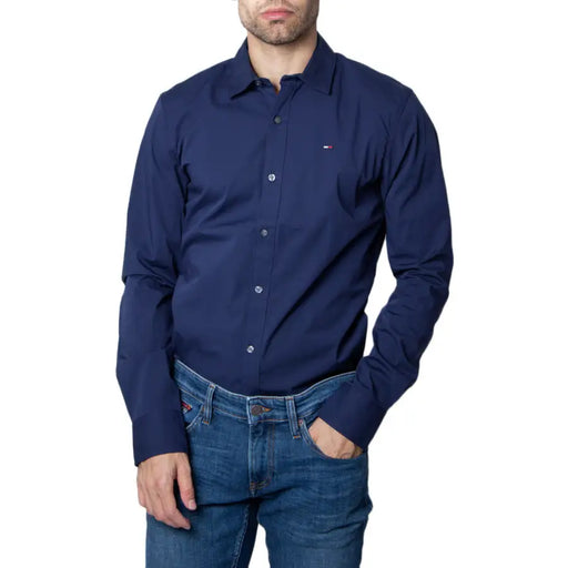 Men’s navy blue long-sleeved button-up shirt from Tommy Hilfiger displayed in product image