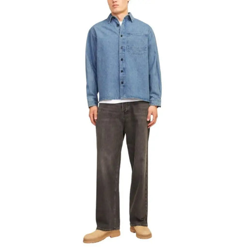 Man’s casual outfit featuring a Casual Denim Jacket, Light Blue Shirt, and Dark Jeans