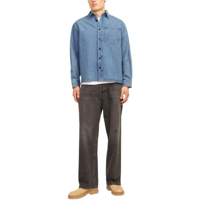 Man’s casual outfit featuring a Casual Denim Jacket, Light Blue Shirt, and Dark Jeans