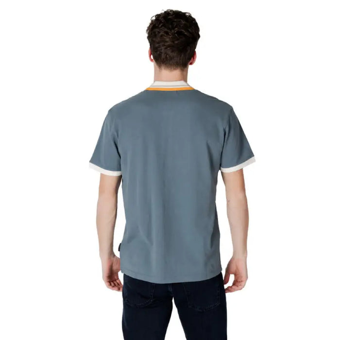 Man wearing a gray short-sleeved shirt from Napapijri Men Green Cotton Polo Shirt