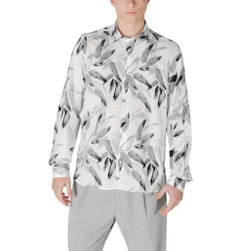 Man in Antony Morato White Floral Classic Shirt featuring a stylish leaf pattern