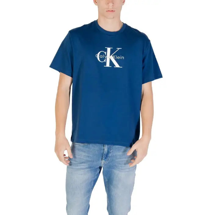 Blue Calvin Klein T-shirt displayed with Maroon Calvin Klein T shirt and Blue Jeans