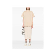 MaxMara beige cotton t-shirt with minimalist white handbag featuring black geometric detailing
