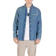 Men blue denim long sleeved shirt with white buttons and a chest pocket in classic denim fabric