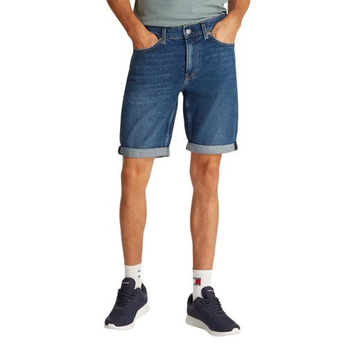Mens blue denim shorts with rolled cuffs and classic five-pocket design in durable cotton fabric
