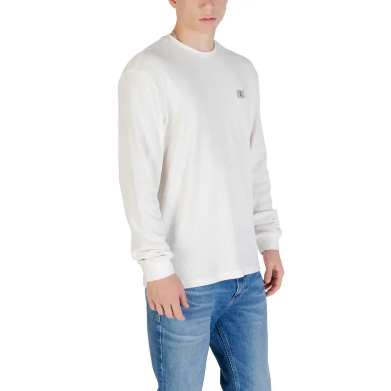 Men’s white long sleeve sweater with small embroidered logo on left chest made of soft cotton blend material