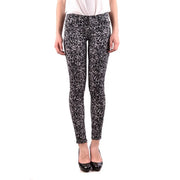 Jean skinny en coton stretch noir pour femme Michael Kors, orné d'un motif moucheté noir et blanc.
