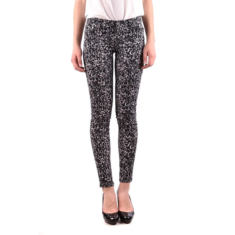 Jean skinny en coton stretch noir pour femme Michael Kors, orné d'un motif moucheté noir et blanc.