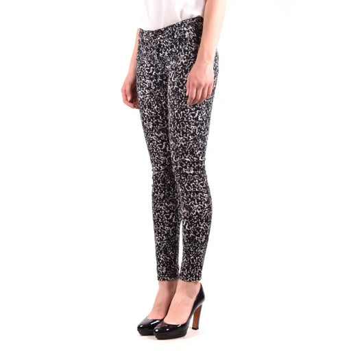Women’s black and white patterned skinny pants with high heels from Michael Kors