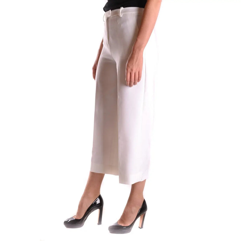 Pantalon stretch crème taille haute à jambes larges Michael Kors pour femme, avec fermeture éclair et bouton blancs.