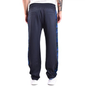 Pantalon de survêtement Missoni pour homme en viscose bleue, coupe classique, avec bandes latérales géométriques bleu marine et vertes vives.