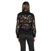 Women’s black long-sleeved sheer lace blouse and black trousers from Morgan De Toi