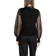 Women’s black long-sleeve turtleneck knitwear with sheer patterned sleeves by Morgan De Toi
