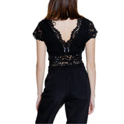 Back view of morgan de toi black lace v neck top with short flutter sleeves and intricate floral patterns
