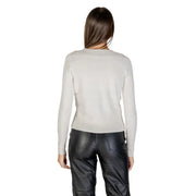 Woman wearing a light-colored long-sleeve top and black leather-look pants with Morgan De Toi White Low V Neck Long Cardigan
