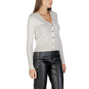 Woman wearing Morgan De Toi white low V neck long cardigan with long sleeves