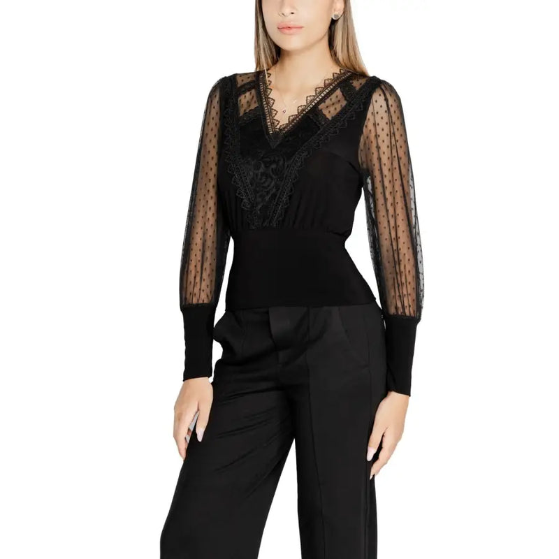 Women’s black long-sleeved V-neck knitwear with sheer polka dot sleeves and lace details