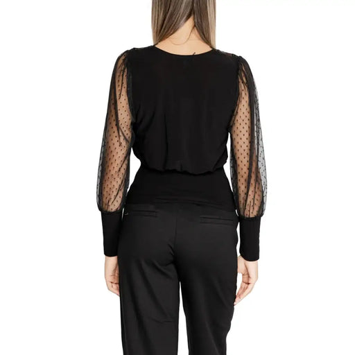 Black women’s long V-neck knitwear with sheer polka dot sleeves from Morgan De Toi