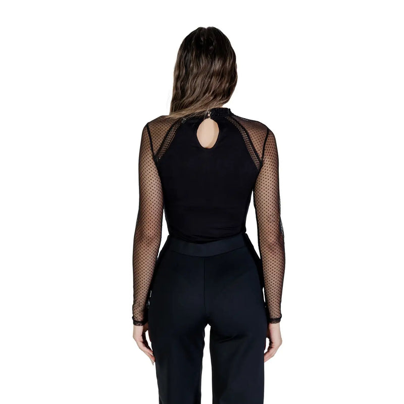 Back view of Morgan de toi women black viscose blouse long sleeve with mesh and back cutout paired with solid pants