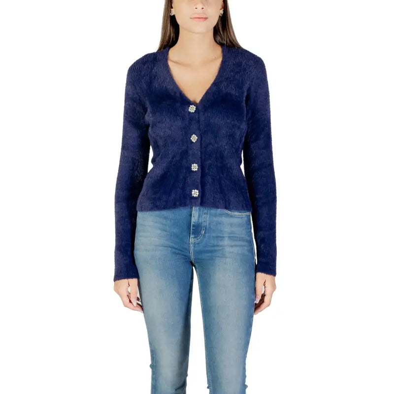 Woman wearing Morgan De Toi navy blue fuzzy cardigan with sparkly buttons