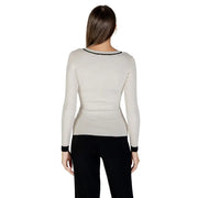 Woman wearing Morgan De Toi beige long-sleeved V-neck knit sweater with black trim